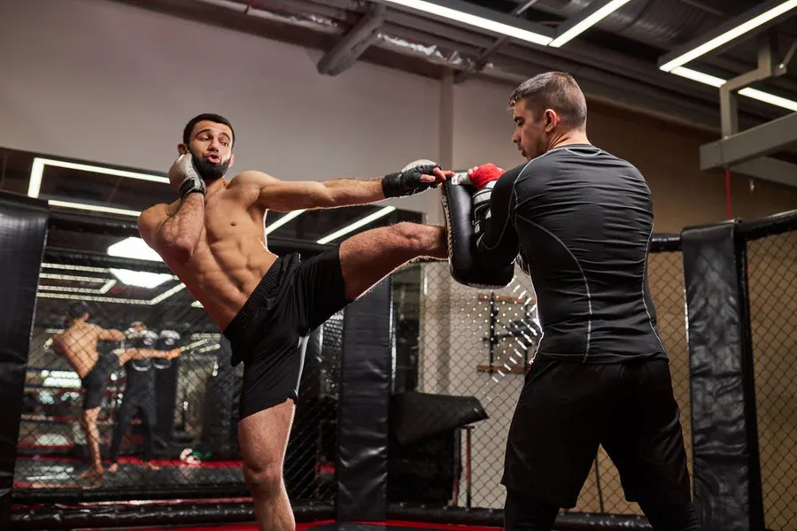 Beginner practicing safe MMA training stance and technique
