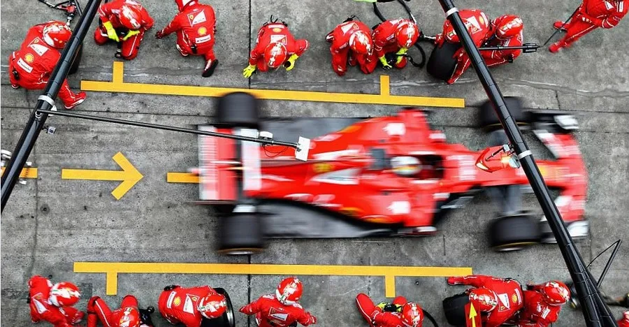 Formula 1 pit stop crew changing tires in under 2 seconds